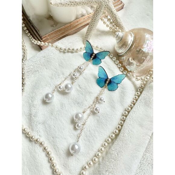Bright blue butterfly earrings with faux pearl dangle ￼ - Picture 4 of 5